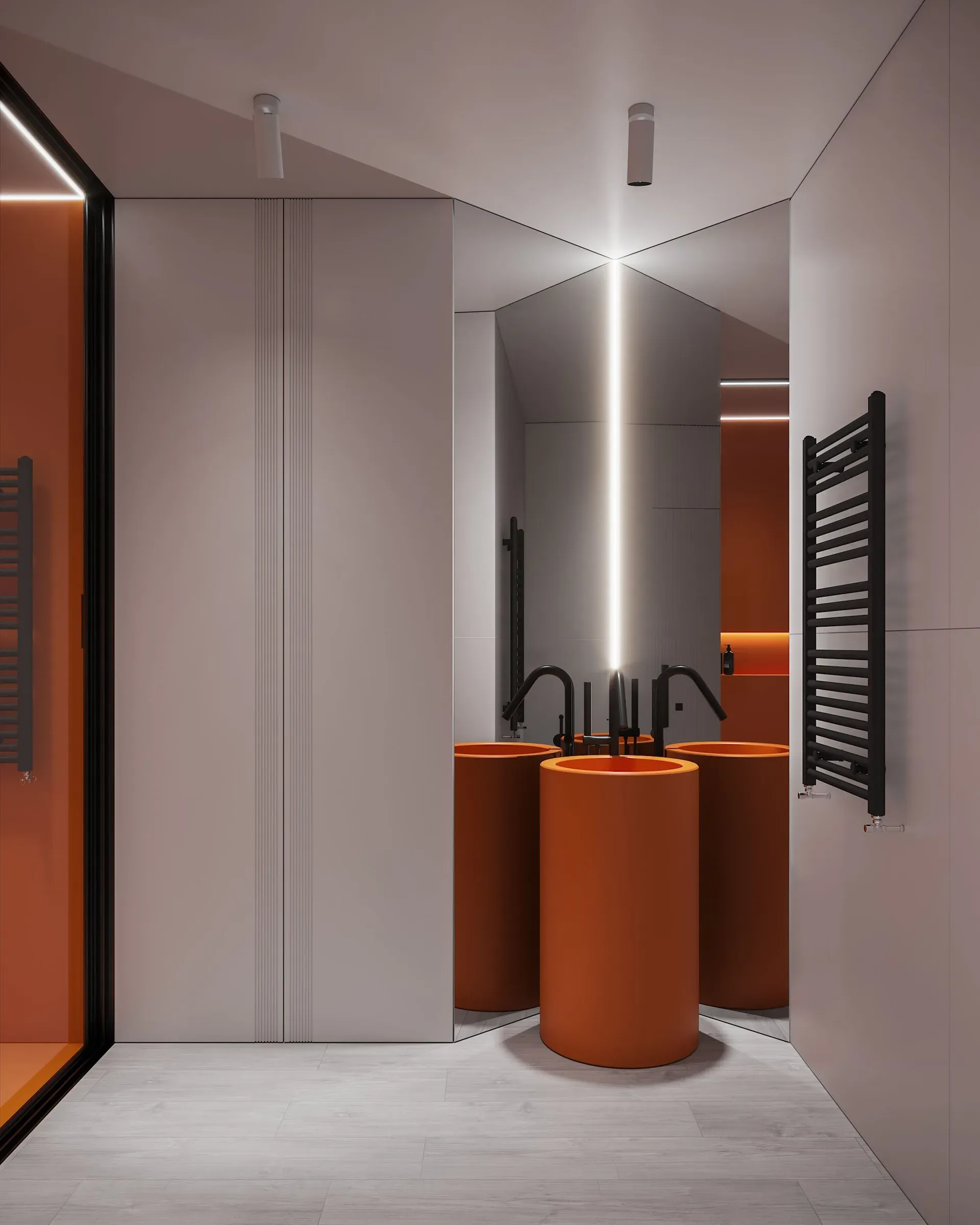 Grey bathroom with bright orange cylindrical pedestal basins, black taps and a ceiling LED strip