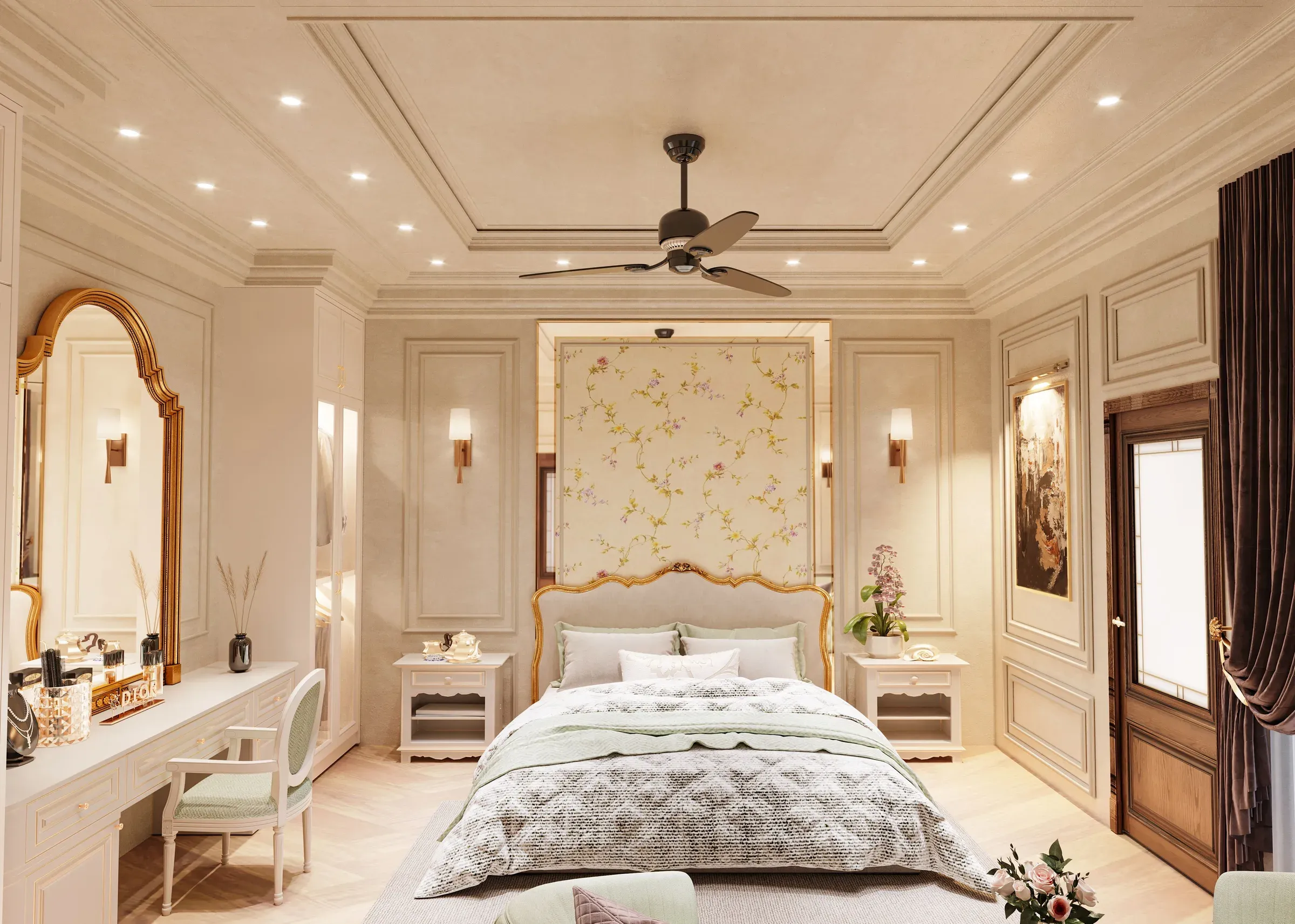 French-style bedroom with a floral wallpaper panel behind the bed, gold-framed bed and dressing table with arched mirror