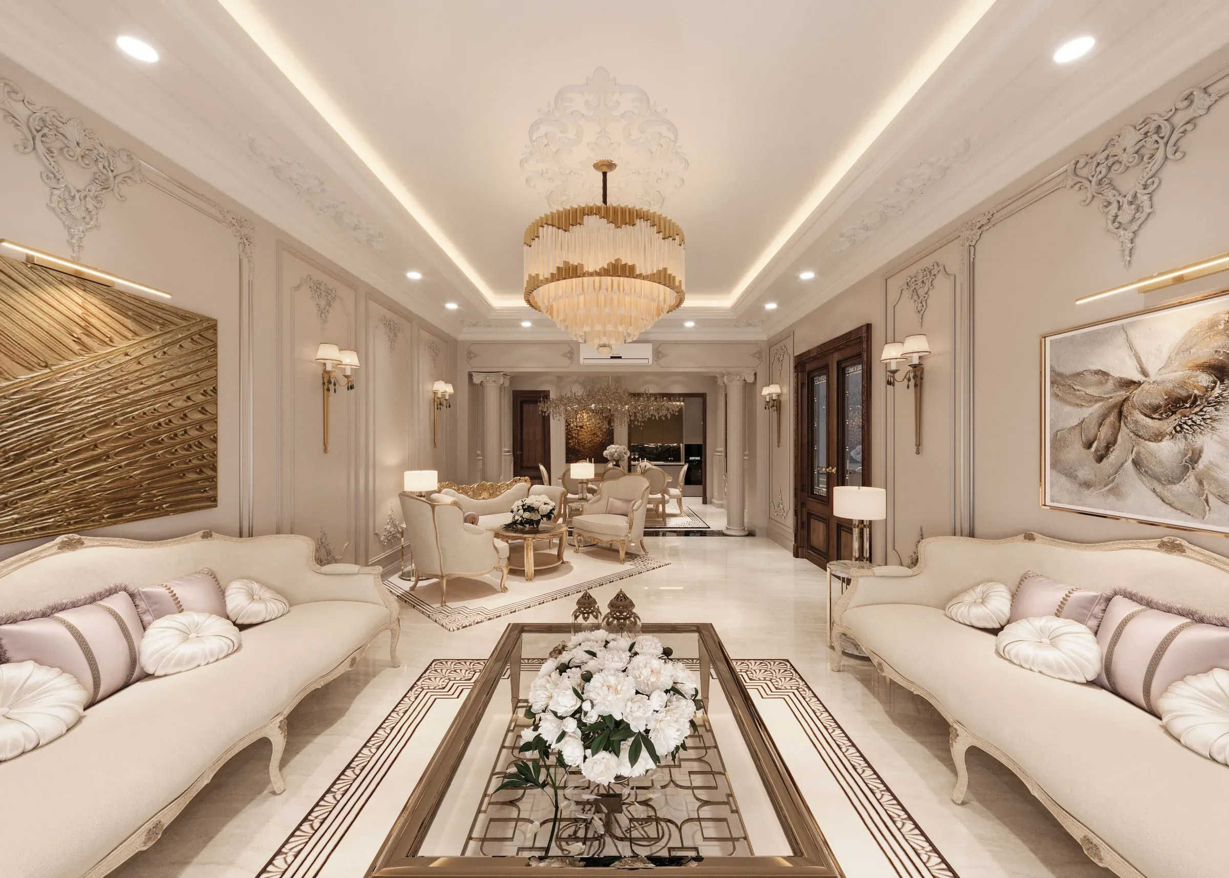 Classic white living room with a gold chandelier, cove-lit ceiling, carved cream sofas and a glass coffee table