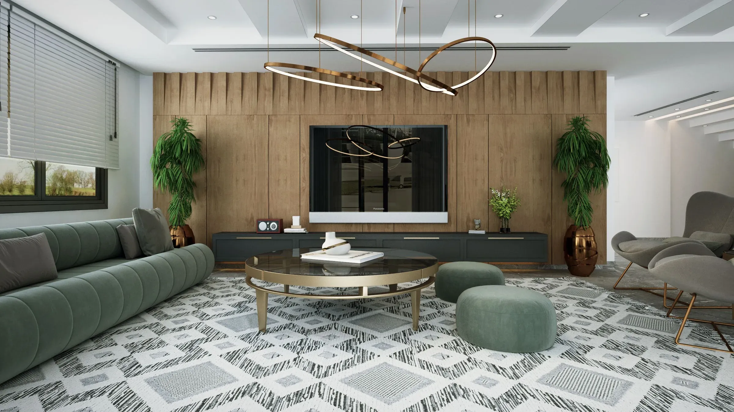 Living room with a green velvet sofa, wooden TV wall, ring chandelier and black-and-white patterned rug